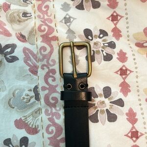 Black leather belt with gold buckle